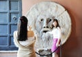 Beautiful asian women photograph each other in front of the mouth of truth Bocca della Verit Royalty Free Stock Photo